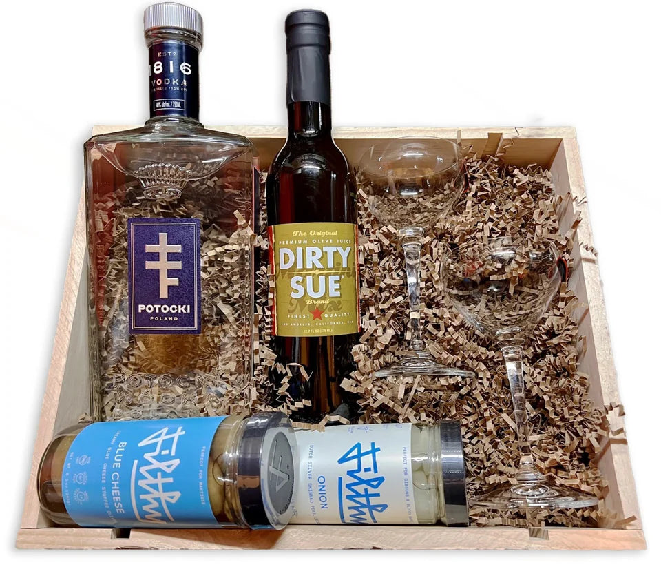 Potocki vodka, Dirty Sue cocktail ingredients, and glassware assembled in a wooden gift crate
