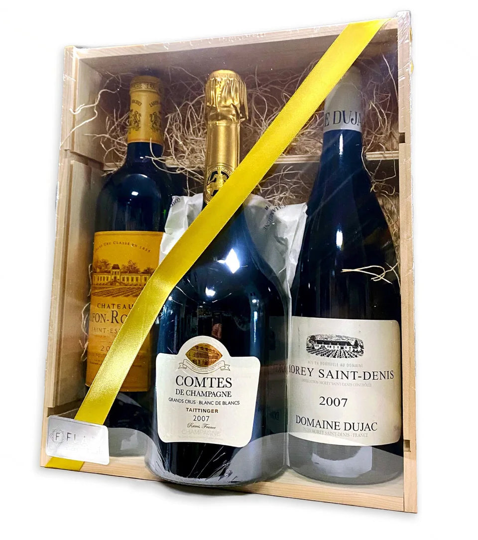 Three-bottle wine and Champagne gift in a wooden box with a yellow ribbon