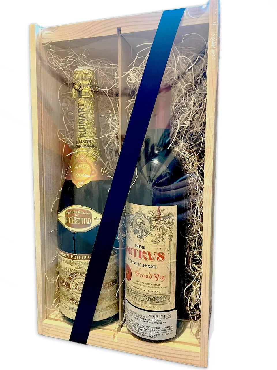Pétrus wine and Ruinart Champagne in a wooden presentation box with a blue ribbon
